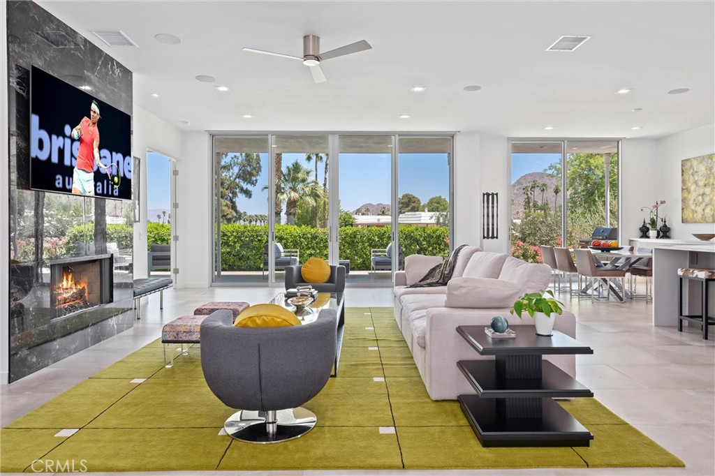 A Rare Find in Iconic Marrakesh. Discover an extraordinary opportunity to own a fully reimagined residence where modern luxury and timeless design converge. Taken down to the studs and rebuilt with meticulous attention to detail, this home offers an open-concept floor plan with three en-suite bedrooms, one of which is a private casita, plus an additional powder room for guests. Every system and surface is brand new: Plumbing, Electrical, HVAC, Windows, Doors, and porcelain Flooring. The chef’s kitchen is a showpiece featuring Arrital Italian cabinetry, Thermador appliances, hidden pantry, and baths are finished with refined, spa-like details. Both Kitchen and Bathrooms are fitted with high-end fixture including Kohler, Blanco, Duravit, etc. This “smart home” outfitted remodel includes a Halo whole-house water filtration system, Aprilaire built-in humidifier, automated lighting and shade controls, and an EV charging station. Outdoor living is equally impressive, complete with a gas fire table, BBQ, and stylish spaces designed for desert entertaining. Home can be available fully furnished creating a true turnkey retreat ready for you to move in and enjoy. Because in Marrakesh, one thing is certain—it’s hard to have a bad day in a pink house!