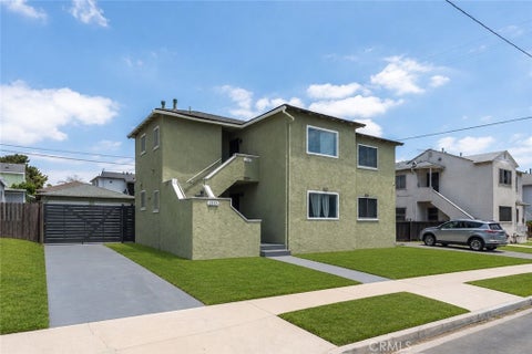 Photo of 2115 W 103rd Place, Los Angeles, CA 90047 (MLS # DW26145329)
