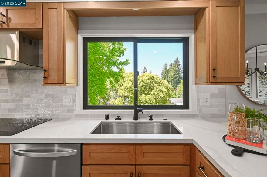This exquisitely remodeled home by Gallo & Associates blends timeless craftsmanship with modern sophistication. At its heart is a custom open-concept kitchen with natural white oak shaker cabinets, gleaming quartz countertops, and premium LG appliances—including a second wall oven with steam and sous vide. A dry bar with dual-zone wine fridge elevates the dining area. The vaulted-ceiling living room offers ambient lighting, a custom electric fireplace with oak mantle, shiplap detail, and built-in cabinetry with integrated media hookups. The serene primary suite features a marble spa bath with dual showerheads, double vanity, walk-in and secondary closets, plus a cozy sitting area with fireplace and TV connections. Enjoy coffee in the sunlit breakfast nook, framed by corner windows with views of the golf course and mature trees. Additional highlights: private office/den, spacious laundry with LG front-loaders, utility room with built-ins, and garage with loft storage. Anderson windows, recessed lighting, central HVAC with heat pump, and attic fans ensure year-round comfort. Exterior perks include access lighting and a deeded golf cart space. Just a short walk to Creekside dining, the Pro Shop, and Event Center—graceful living awaits.