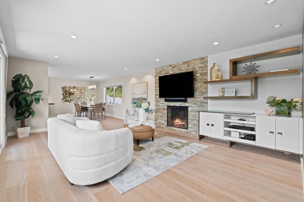 First time on the market in 49 years! Privacy abounds this stunning, split-level home set on a tree studded 16,000 sq ft lot in Millbrae Highlands with a connection to nature. Boasting serene canyon and bay views, this home has been meticulously remodeled with attention to details. The main level is an open-concept, seamlessly integrating living, dining, and kitchen areas, highlighted by picturesque windows, wide plank wood floors and a fireplace with an ornate stone facade. The professionally designed kitchen features all stainless steel appliances including a 6-burner gas oven range, custom crafted cabinets and a central island. A half-level up are three bedrooms, including a primary suite, two brand-new baths, and newly refinished hardwood floors. Downstairs, the family room with a wet bar and a remodeled guest bath is ideal for entertaining. An adjacent studio, with its own entrance and full bath, offers versatile uses as a home office/workshop/exercise studio or guest suite. Enjoy outdoor living w/multiple levels of deck space, accessible from the kitchen & family room. The 2 car garage features a full wall of storage cabinetry and an epoxy floor. Enjoy a thriving downtown, Saturday's farmers market & Millbrae's highly regarded schools.