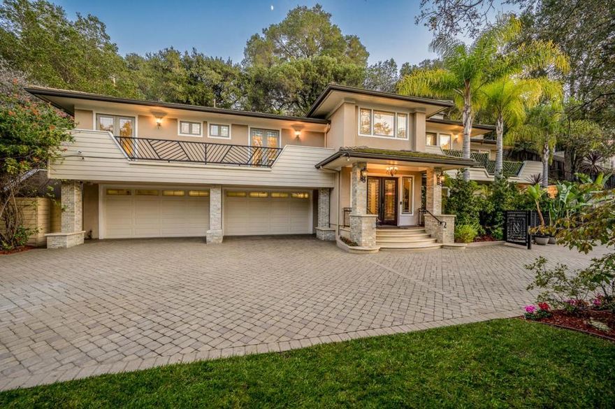This exceptional Frank Lloyd Wrightinspired gated estate offers a rare combination of architectural drama, privacy, and park-like serenity on a 0.41-acre lot. A custom-designed security gate opens to a private driveway leading to a grand custom home. A dramatic foyer with designer staircase and decor iron railings introduces voluminous living, family & dining rooms, plus 3 upstairs bedroom suites. The gourmet kitchen showcases top-of-the-line appliances, 48-inch commercial gas range with 54-inch hood & double ovens, dual refrigerators/freezers, two dishwashers, slab granite island & custom cabinetry. Exceptional finishes include hand-scraped hardwood floors, Picasso crystal lighting, monumental crown moulding, architectural columns & designer stonework. Additional highlights include a cinema-quality media room, balconies from suites, 2 wet bars,3 fireplaces, 3 A/C zones, whole-home sound & security system. Oversized 4-car garage plus 1,200+ sq ft storage. The expansive rear yard is a private sanctuarycomplete with bocce court, lush landscaping, entertainment terraces & beautiful open viewscreating a peaceful private retreat just minutes to Covington Elementary, Egan Middle, Los Altos High, Los Altos Downtown, MV Downtown and major tech employers Google, Apple, Tesla & Meta.