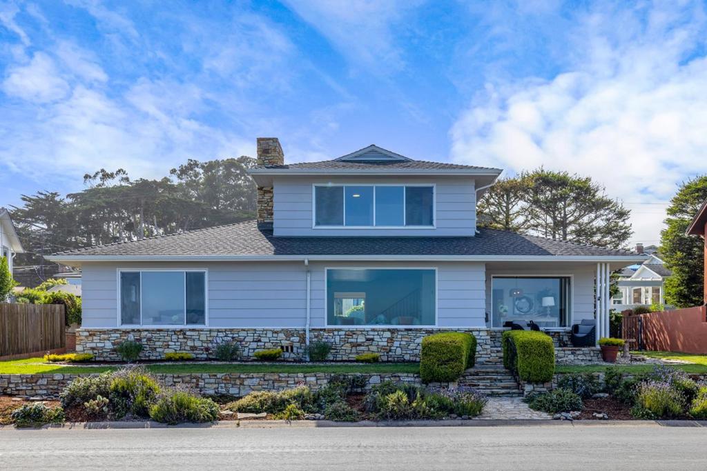 Experience the ultimate coastal lifestyle in this stunning home boasting front-row seats to playful sea otters, breaching whales, and graceful sailboats gliding across the bay. Perfectly positioned on a rare double lot along Pacific Grove's pristine and protected coastline, this residence offers commanding ocean views from nearly every room. Inside, a spacious layout includes 3 bedrooms, 3 bathrooms, a formal dining room, and an extra family room that can easily serve as a fourth bedroom, providing flexibility for guests or extended family. The two-car garage ensures convenience, while the private outdoor spaces invite you to relax and soak in the fresh ocean air. Just steps from the charming boutiques and renowned dining of downtown Pacific Grove, and a short drive to Pebble Beach, Carmel-by-the-Sea, and Monterey Bay Aquarium, this home seamlessly blends tranquil seaside living with walkable access to vibrant local culture. This is more than a home, it is a front-row seat to nature's most spectacular show.