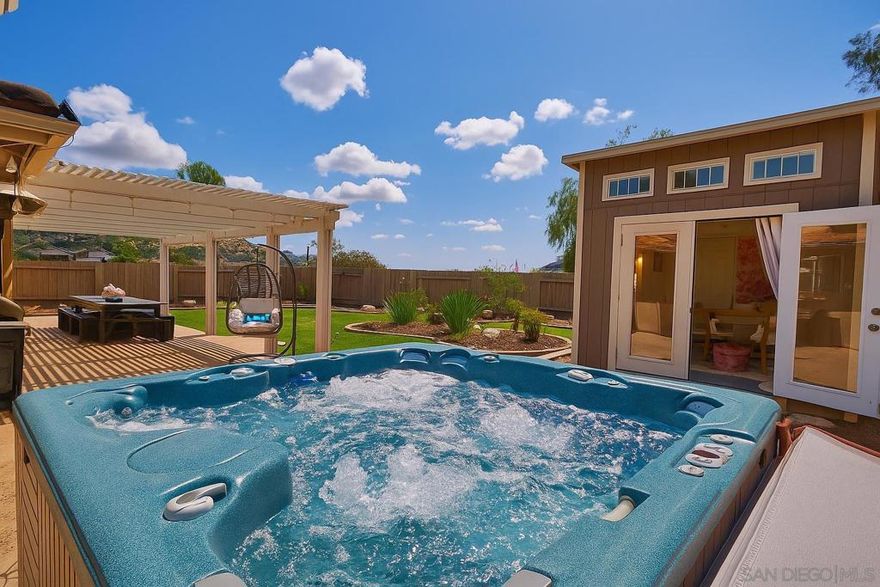 NO HOA, OWNED SOLAR...and room for a pool, storage for your boat/RV/toys and maybe even an ADU. Amazing breezes, gorgeous sunsets & mountain views delight you daily at this home. Highly desired bedroom & full bath on the main floor, 20 panel solar system with favored NEM2, NEW 2025 water heater, updated kitchen and baths. 5th optional room is a detached insulated den that was professionally built and stays cool/warm with its own mini split HVAC - the perfect quiet escape for a zoom meeting, creative workshop, play zone or even a guest sleeping room. Primary bedroom has westerly views, walk-in closet, steam shower, soaking tun & mini-split HVAC for those times that you only want to heat or cool your bedroom. Tucked away at the end of a cul de sac, enjoy privacy on this elevated, oversize lot. Minutes from the 8 freeway schools & shopping. 30 minutes away from San Diego's main attractions, beaches, airport, and yet feels like a whole different, relaxed, world! Living here provides for the ultimate outdoor lifestyle: hiking trails, fishing, boating & camping at Lake Jennings and Flinn Springs 40-acre County Park. Whether outdoorsy means you like to drink wine on a patio with a view, or you like to take your dog on a hike, this place has both for you!