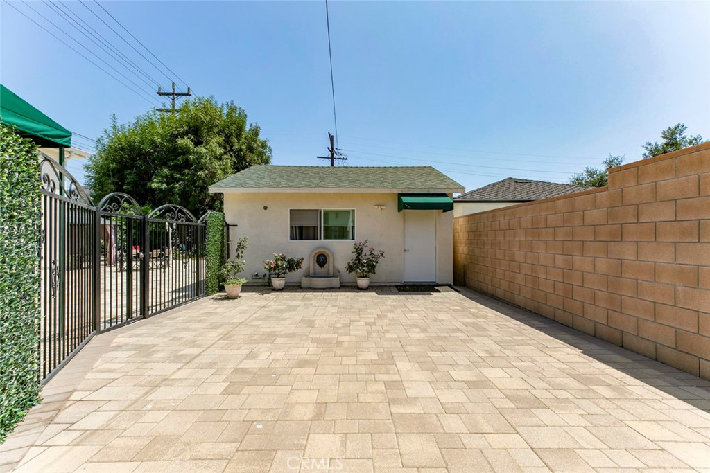 Modern and private back house for rent in Glendale featuring 2 bedrooms and 1 bathroom with approximately 600 sqft of living space. This updated unit offers an open layout with stylish laminate flooring, recessed lighting, and a bright kitchen with white cabinetry, stainless steel appliances, and a marble-style backsplash. The bathroom includes a glass-enclosed shower and modern finishes. Both bedrooms are comfortably sized with good natural light. Enjoy the convenience of a private entrance, in-unit laundry, included internet, and a clean gated patio area. Located in a quiet neighborhood with easy access to nearby shops, dining, and freeways. Street parking only.