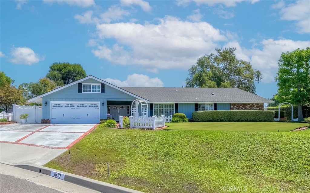 This charming ranch style single-story home exudes warmth and character, with timeless touches and a sense of comfort. It's the kind of place where memories are made, cozy, inviting and truly feels like home! Incredible opportunity to own a home in the prestigious Sunny Hills community of Fullerton—nestled among rolling hills, mature trees, and serene natural surroundings. This lovely home sits on a amazing, flat 15,750 sq. ft. lot, in a desirable cul-de-sac, offering privacy, seclusion, and endless potential. Lovingly maintained by the same owners for over 45 years, this home is in immaculate condition with an open and functional layout spanning approximately 2,200 sq. ft. It features four bedrooms, a spacious playroom, and two bathrooms. Exceptional curb appeal greets you at the double front doors, opening into a bright, welcoming interior that reflects true pride of ownership. The inviting living room features a classic brick fireplace, while the formal dining room and cozy family room—highlighted by charming wood-beamed ceilings and views of the beautifully manicured front garden—are perfect for gatherings. The tastefully remodeled kitchen boasts Quartz countertops, custom tile backsplash, upgraded cabinetry, stainless steel appliances, large tray ceiling, and a casual breakfast bar. Additional highlights include dark laminate flooring, plush carpeting a spacious playroom with built-in shelving, dual-pane windows and sliding doors throughout, crown molding, plantation shutters, scraped ceilings, and recessed lighting. The primary suite features dual mirrored closets and a walk-in shower. Upgraded central air conditioning and heating system. Step into the expansive, private, backyard—professionally landscaped with over $100,000 in improvements including stunning concrete pavers, a covered patio, vibrant flower beds, updated sparkling pool, fire pit, basketball court, and large side yards with newer vinyl fencing. This outdoor space is perfect for entertaining or relaxing in multiple seating areas. Located within the boundaries of award-winning schools: Laguna Road Elementary, Parks Junior High, and Sunny Hills High School. Conveniently close to St. Jude Hospital, parks, golf courses, grocery stores, and Amerige Heights Shopping Center. No HOA!