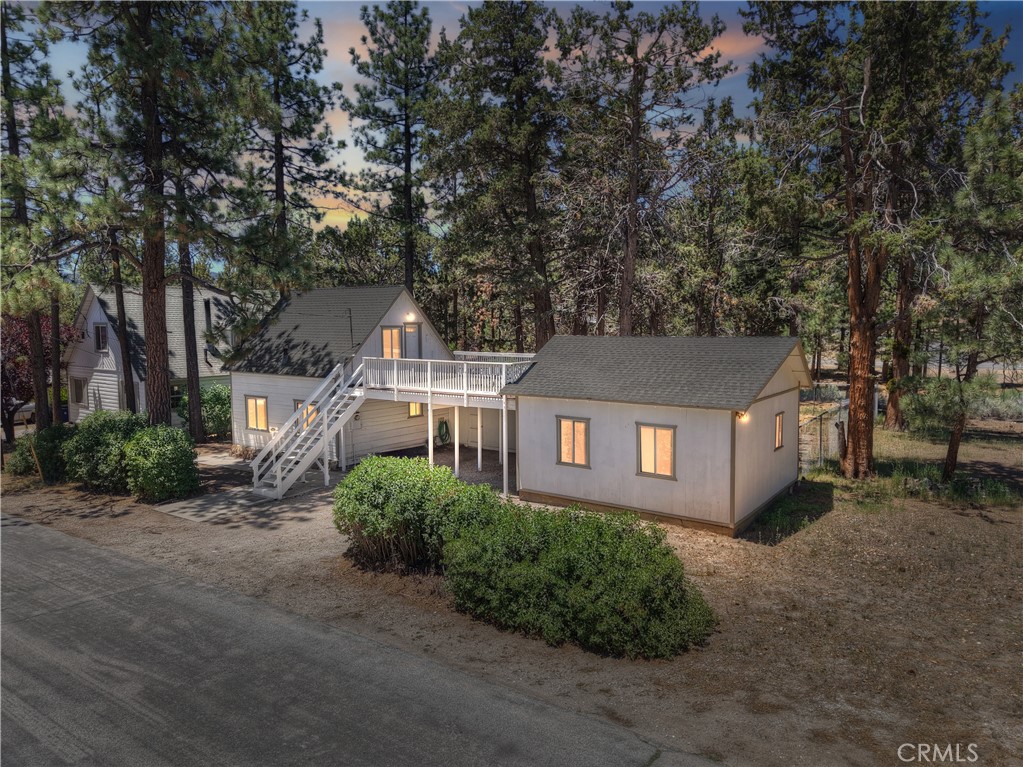 This cabin has been in the same family for over 45 years ~ Now they are giving you the opportunity to add to the homes history ~ Downstairs you have the living room, kitchen, family room, 1 bedroom and the bathroom ~ Upstairs gives you a huge bedroom with its own access to the raised deck above the carport ~ The workshop area gives you options to expand ~ Sitting on a 22,185 square foot, flat level lot, giving you room for all of your toys, a guest house or a horse ~ Only a short walk gets you to Van Dusen Canyon Rd and the National Forest, an ideal location for those that enjoy the outdoors and off-roading ~ The yard has a large fenced area for kids and pets to play ~ Whether you are looking for your full time residence, or are an outdoor enthusiast this property is perfect with plenty of room to go.