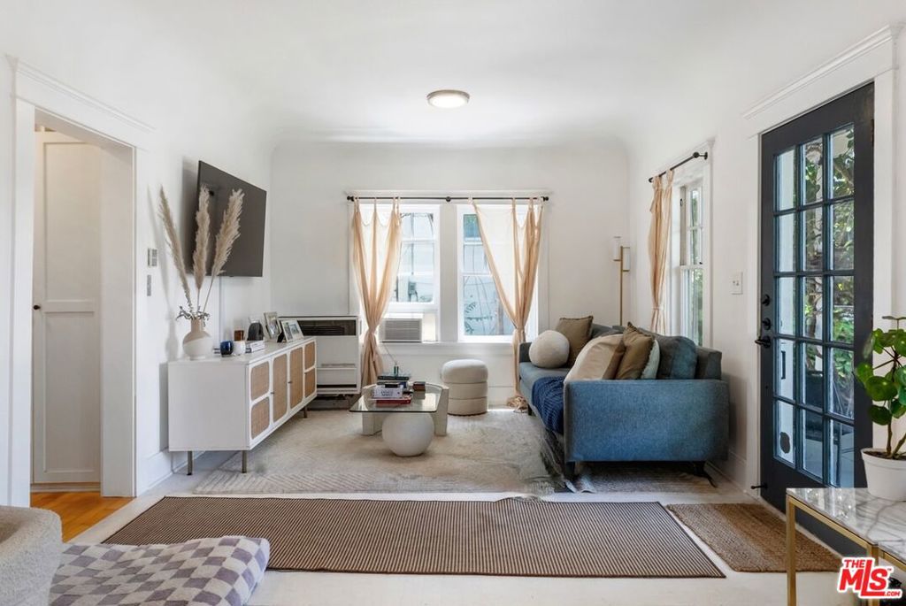 Perfect owner-user income property in one of Los Angeles' most beloved historic neighborhoods. Built in 1925, this charming Angelino Heights triplex features three well-maintained and spacious 2-bedroom, 1-bathroom units. Each offers bright, open living areas, in-unit laundry, and private outdoor spaces with west-facing views of the hills. The property blends vintage 1920s charm: hardwood floors, French doors, and built-ins with tasteful modern updates: new windows, electrical upgrades, a new roof, and updated appliances. Two of the units are currently leased ($3,600 and $3,400/month), while the top unit is owner-occupied and will be delivered vacant ($4,000/month). Located in Angelino Heights HPOZ, one of Los Angeles' most distinguished historic districts, this triplex is just around the corner from Echo Park Lake and moments from the nightlife and amenities of Sunset Boulevard. It offers the perfect combination of historic character and urban convenience. Easy to show with 24-hour notice.