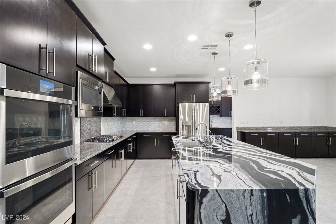 The sleek, modern kitchen is a masterpiece, showca