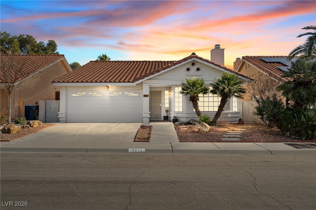 Mediterranean / spanish-style home with a tile roo