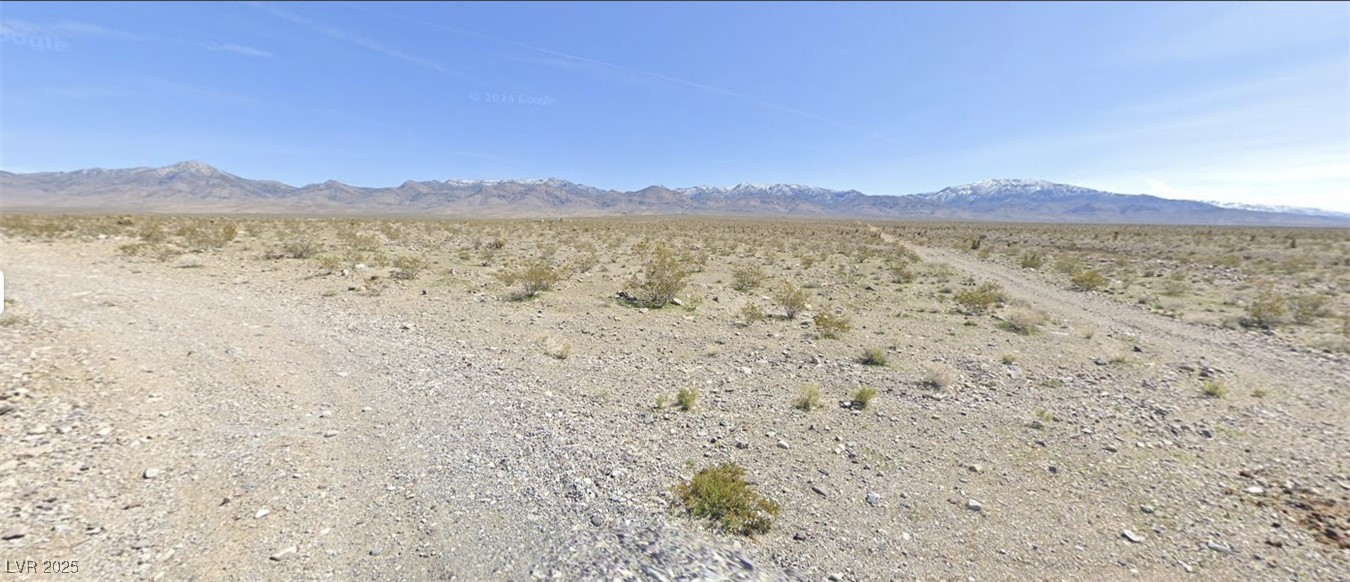 View of mountain backdrop with a desert landscape