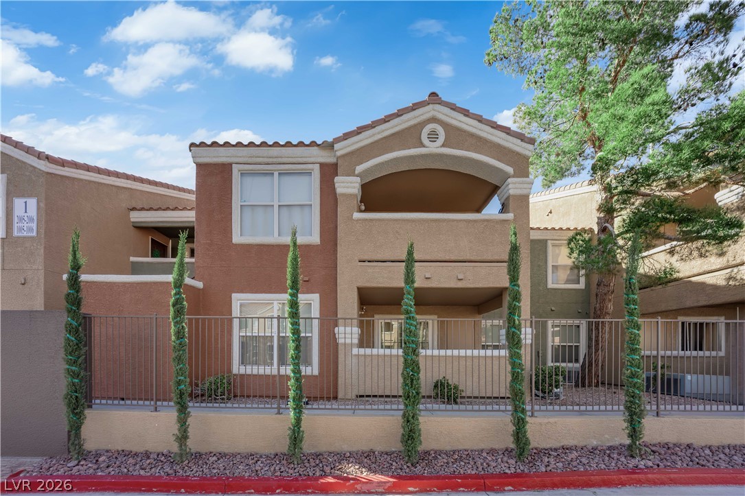 View of front facade featuring stucco siding
