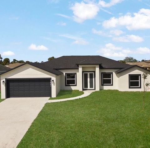 Photo of 5806 Tangelo Drive, Fort Pierce, FL 34982 (MLS # RX-11118786)