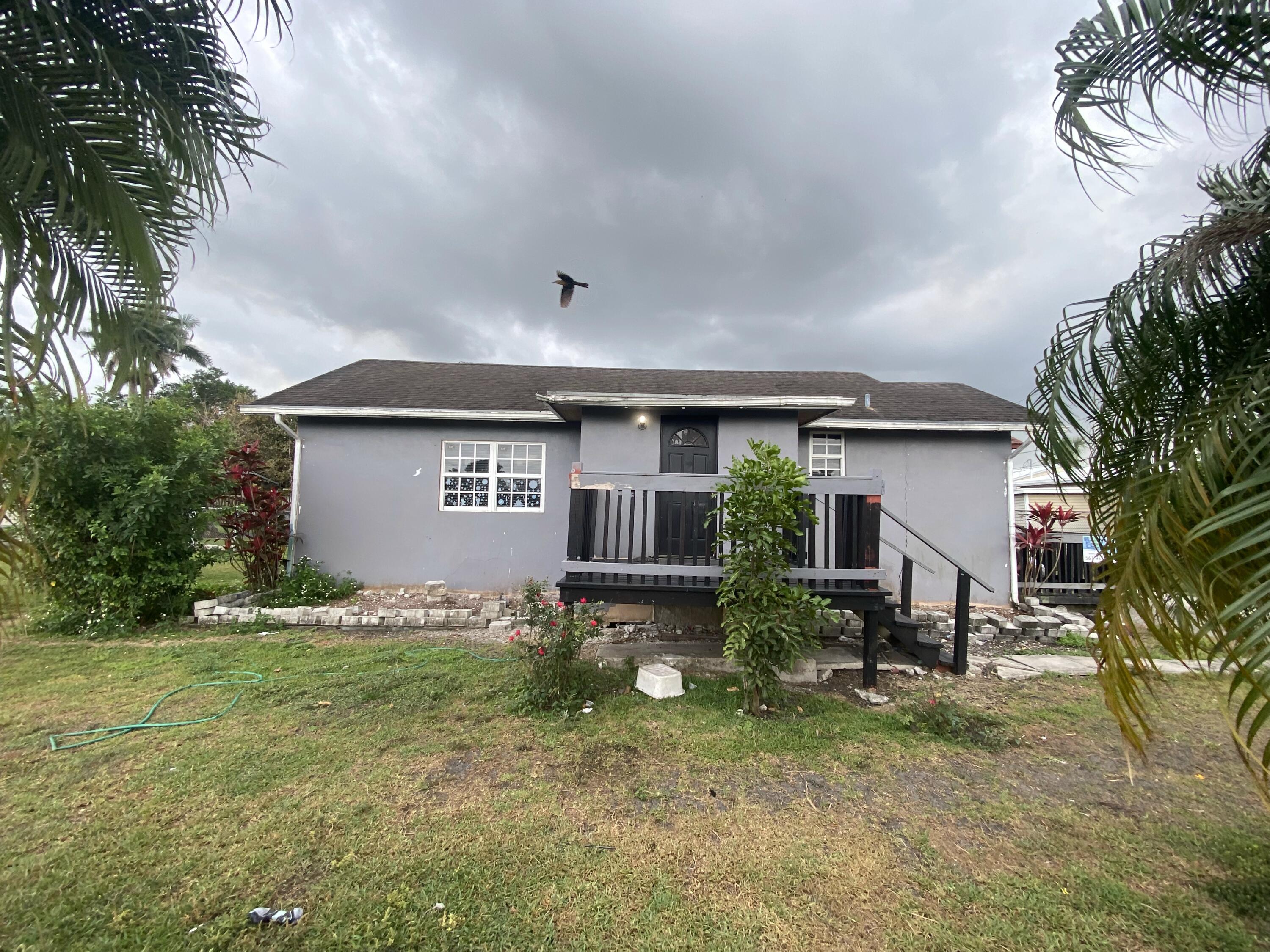 Property for Sale at 116 Nw Avenue G Avenue, Belle Glade, Palm Beach County, Florida - Bedrooms: 3 
Bathrooms: 2  - $175,000
