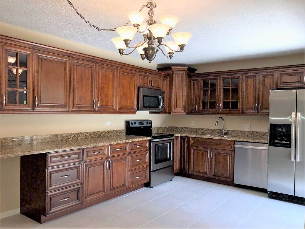 Photo of 1210 12th Terrace, Palm Beach Gardens, FL 33418 (MLS # RX-10996198)