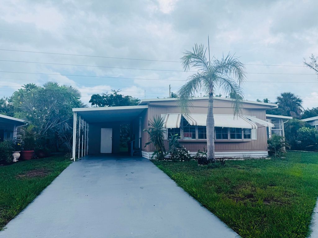 Photo of 18 Cozumel Lane, Port Saint Lucie, FL 34952 (MLS # RX-11123128)
