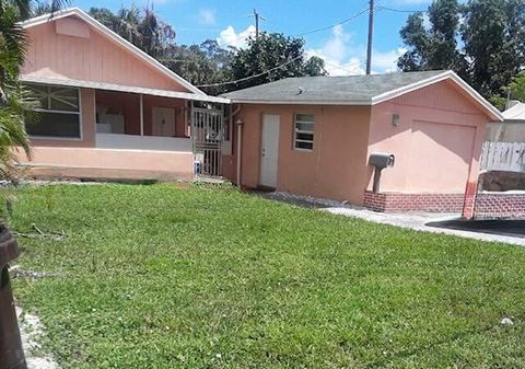 Photo of 1017 W Lakewood Road, West Palm Beach, FL 33405 (MLS # RX-11127136)