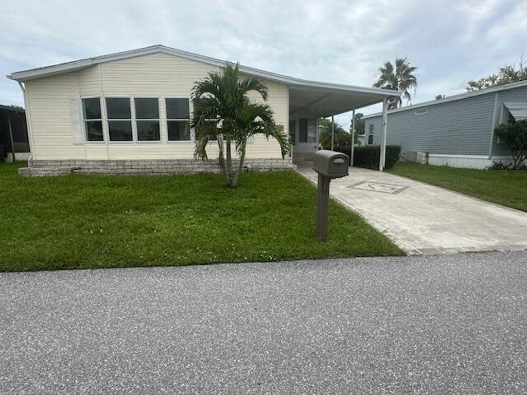 Photo of 6516 Spanish Lakes Blvd Boulevard, Fort Pierce, FL 34951 (MLS # RX-11124787)
