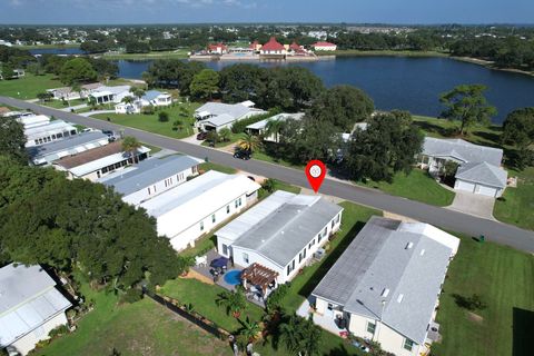 Photo of 392 Egret Circle, Barefoot Bay, FL 32976 (MLS # RX-11128972)