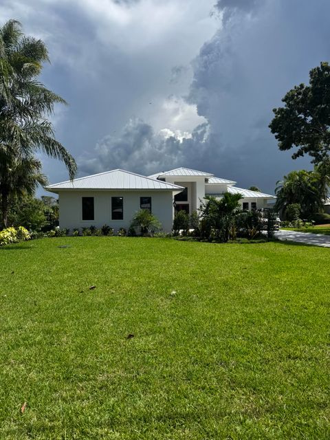 Photo of 1064 NW Spruce Ridge Drive, Stuart, FL 34994 (MLS # RX-11112930)
