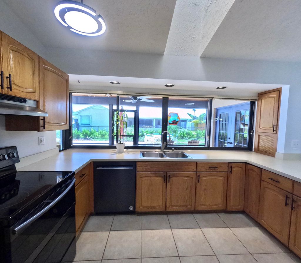 Photo of 1927 NE San Carlos Calle, Jensen Beach, FL 34957 (MLS # RX-11126589)