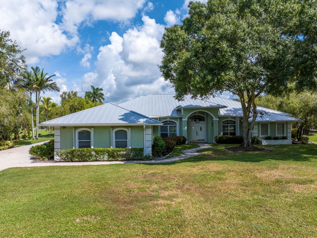 Photo of 5530 SW Orchid Bay Drive, Palm City, FL 34990 (MLS # RX-11113837)