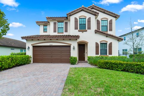 Photo of 1310 Whitcombe Drive, Royal Palm Beach, FL 33411 (MLS # RX-11116893)