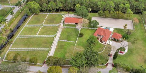Photo of 3950 Horse Trail, Loxahatchee, FL 33470 (MLS # RX-11054611)