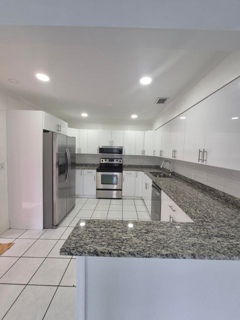 Photo of 415 Forest Hill Boulevard, West Palm Beach, FL 33405 (MLS # RX-11126027)