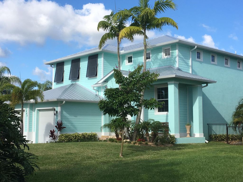 Photo of 1468 SW Peninsula Lane, Palm City, FL 34990 (MLS # RX-11115940)