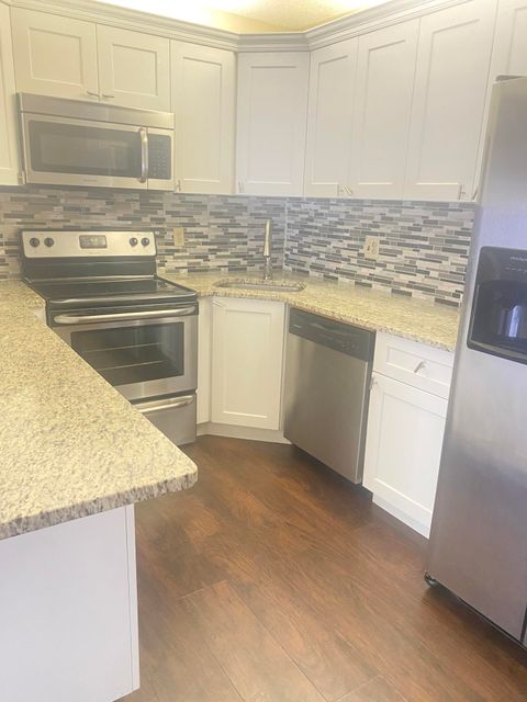 Photo of 1010 Green Pine Boulevard #D1, West Palm Beach, FL 33409 (MLS # RX-11127592)