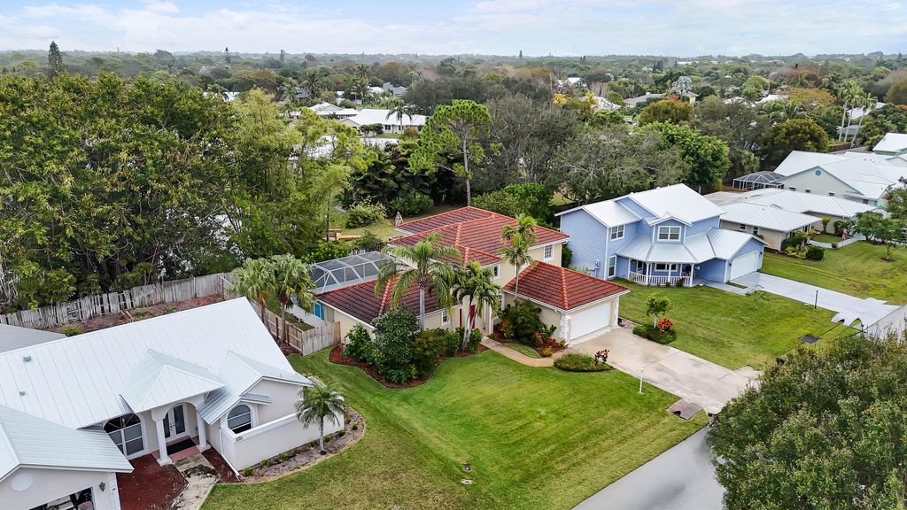 Photo of 661 NE Zebrina Senda, Jensen Beach, FL 34957 (MLS # RX-11118249)