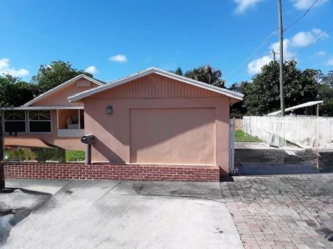 Photo of 1017 W Lakewood Road, West Palm Beach, FL 33405 (MLS # RX-11127125)