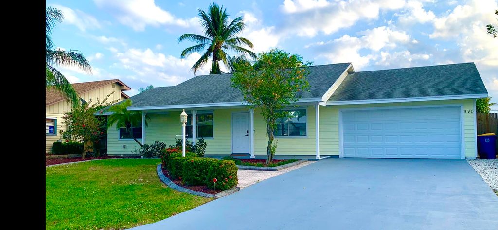 Photo of 598 NE Maranta Terrado, Jensen Beach, FL 34957 (MLS # RX-10850103)