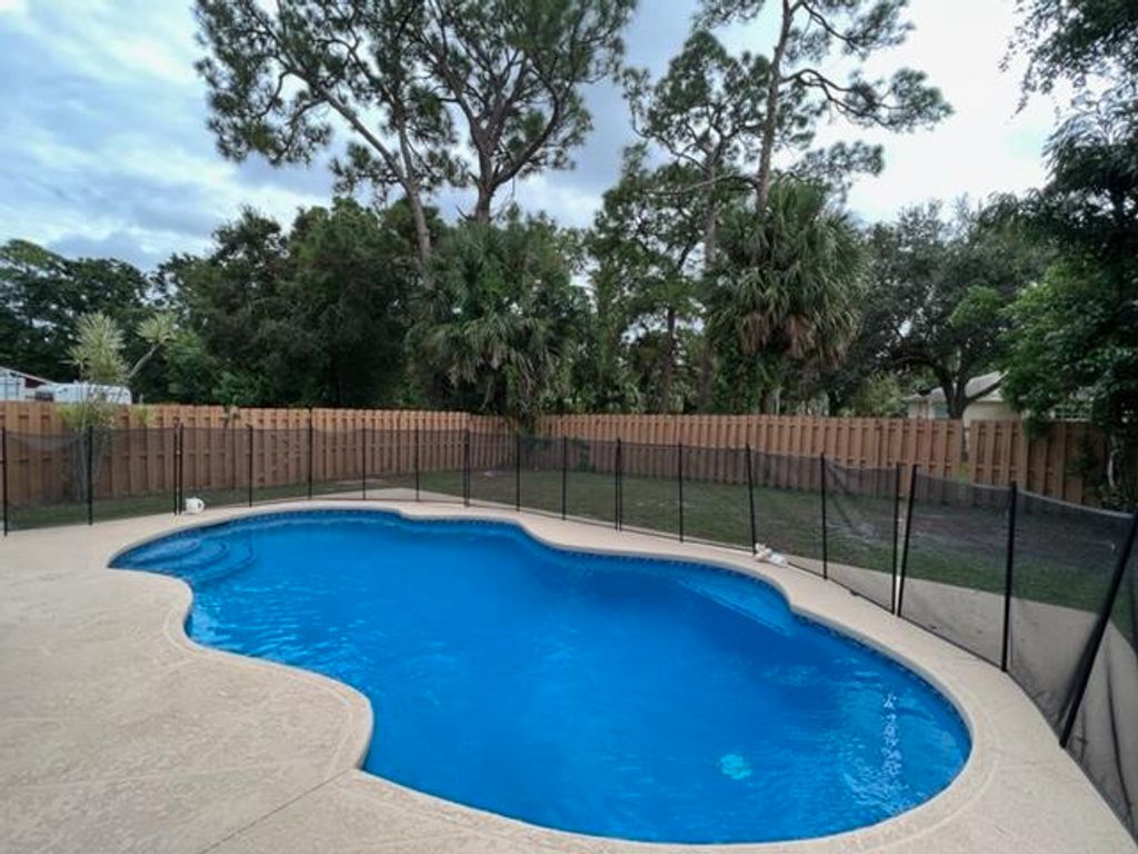 Photo of 970 SW 31st Street, Palm City, FL 34990 (MLS # RX-11043280)