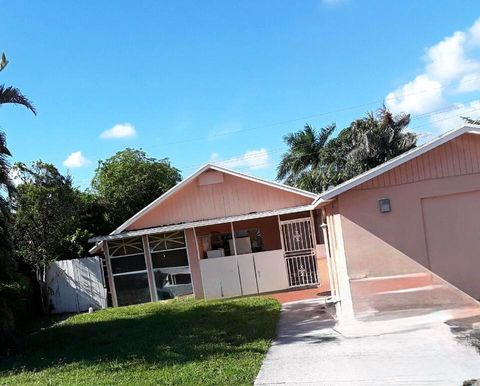 Photo of 1017 W Lakewood Road, West Palm Beach, FL 33405 (MLS # RX-11127130)