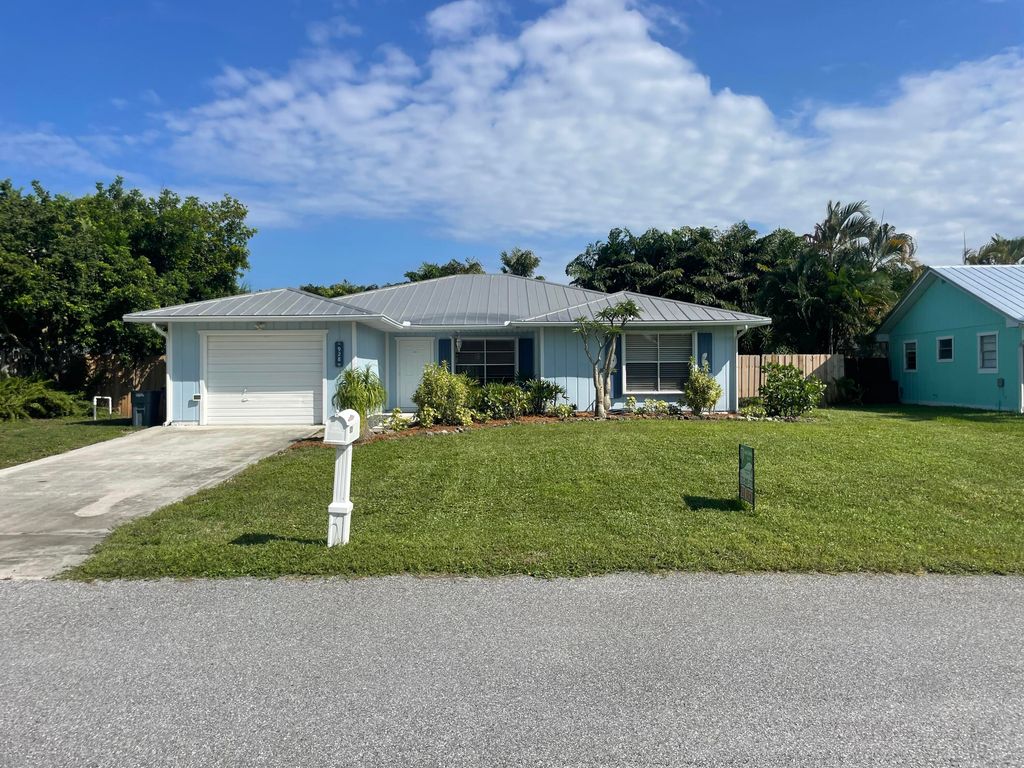 Photo of 928 NE Maranta Terrado, Jensen Beach, FL 34957 (MLS # RX-11007823)