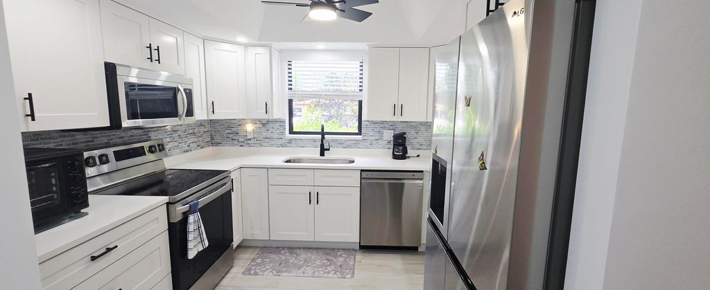 Photo of 841 SW South River Drive #102, Stuart, FL 34997 (MLS # RX-11119700)