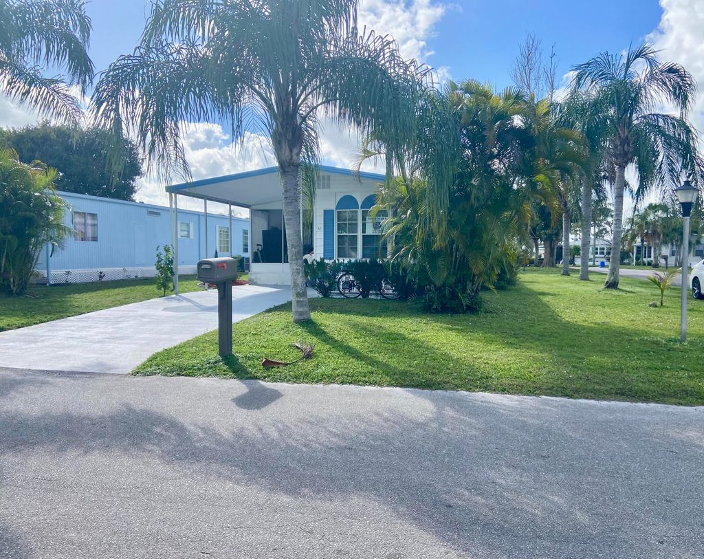 Photo of 52 Camino Del Rio, Port Saint Lucie, FL 34952 (MLS # RX-11061908)