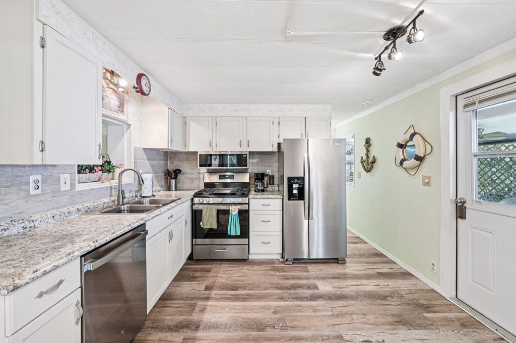 Photo of 4756 NE Blue Heron Lane, Jensen Beach, FL 34957 (MLS # RX-11127092)