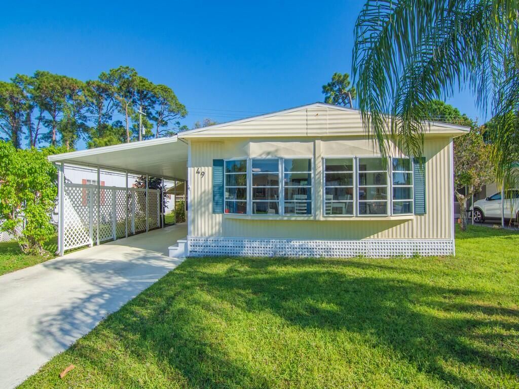 Photo of 49 Camino Del Rio, Port Saint Lucie, FL 34952 (MLS # RX-11070899)