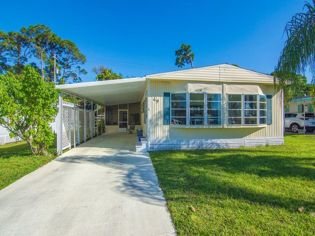 Photo of 49 Camino Del Rio, Port Saint Lucie, FL 34952 (MLS # RX-11070899)