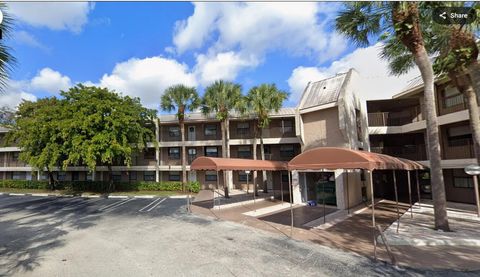 Photo of 8747 Shadow Wood Boulevard #104, Coral Springs, FL 33071 (MLS # RX-11129754)