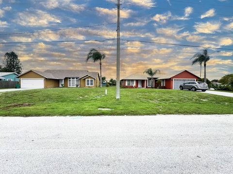 Photo of 2402 SW Monterrey Lane, Port Saint Lucie, FL 34953 (MLS # RX-11129023)
