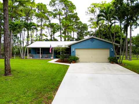 Photo of 15733 Temple Boulevard, Loxahatchee, FL 33470 (MLS # RX-11125970)