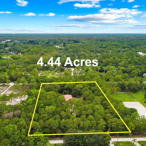Photo of 18420 Windsong Way N, Jupiter, FL 33478 (MLS # RX-11119983)