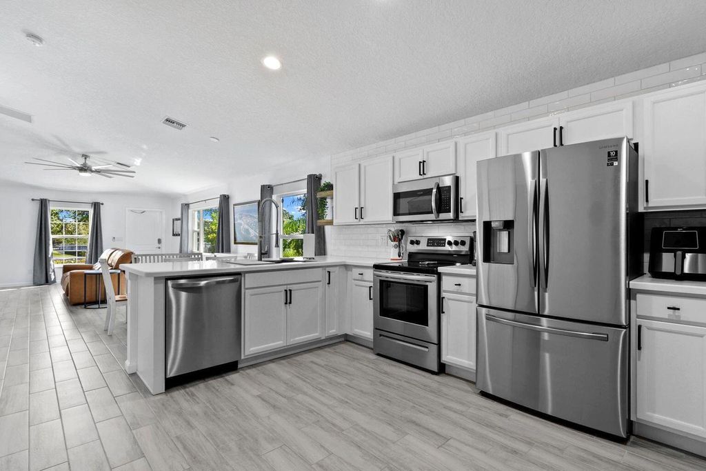 Photo of 5032 SE Flounder Avenue, Stuart, FL 34997 (MLS # RX-10996774)