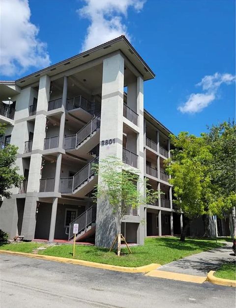 Photo of 2801 Riverside Drive #307-S, Coral Springs, FL 33065 (MLS # RX-11115028)