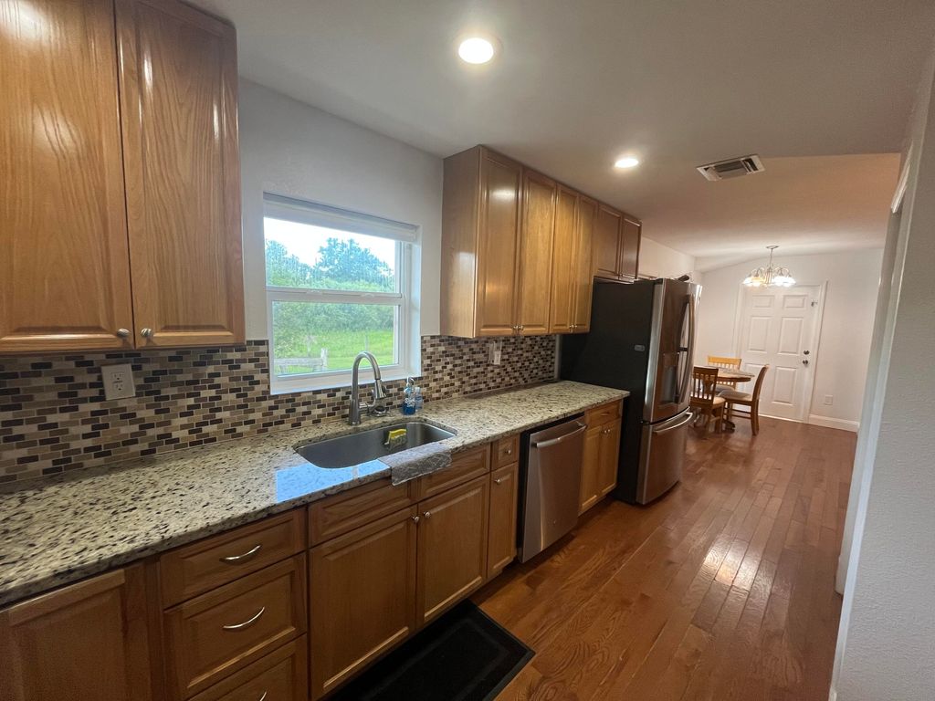 Photo of 6404 SW Woodham Street, Palm City, FL 34990 (MLS # RX-11091098)