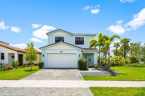 Photo of 5571 Quiet Lake Place, Loxahatchee, FL 33470 (MLS # RX-11124813)