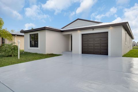 Photo of 50 La Puerte Del Norte, Fort Pierce, FL 34951 (MLS # RX-11126284)